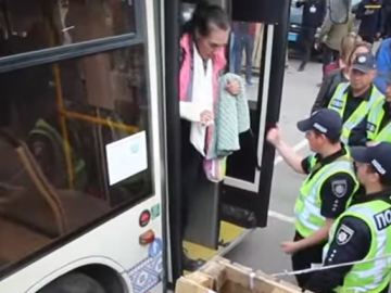 Woman exiting bus